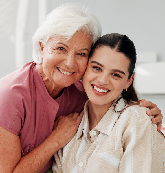 Smiling woman outside with healthy teeth